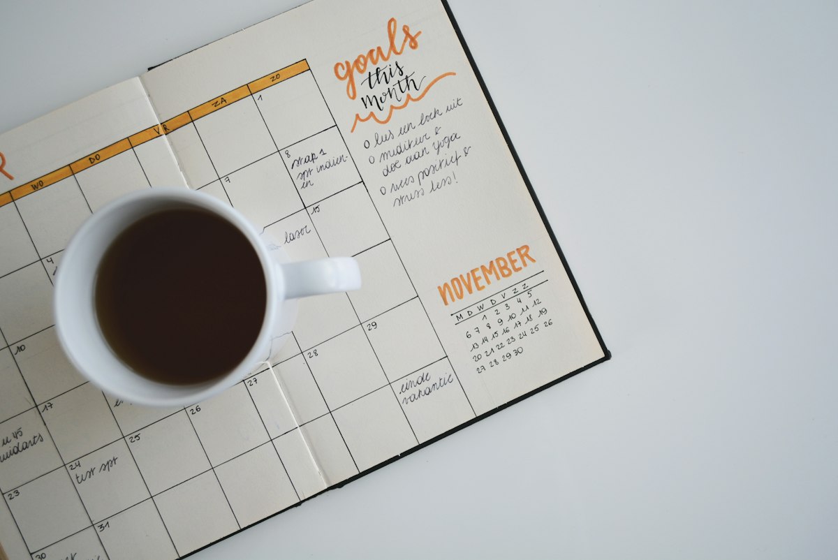 Planner with a cup of coffee